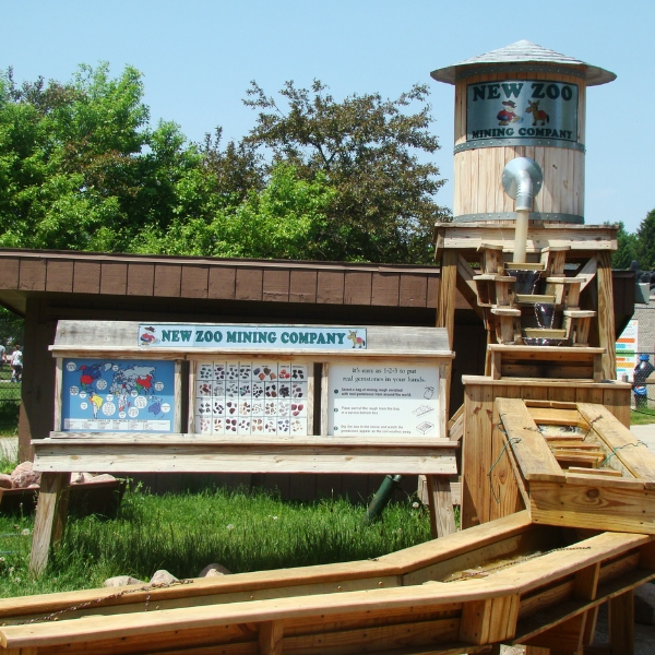 Minig sluice with a sign that says "new zoo mining company"