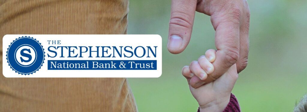 The Stephenson National Bank & Trust logo is overlayed on a backdrop of a close-up of a dad holding the hand of a small child walking beside him.